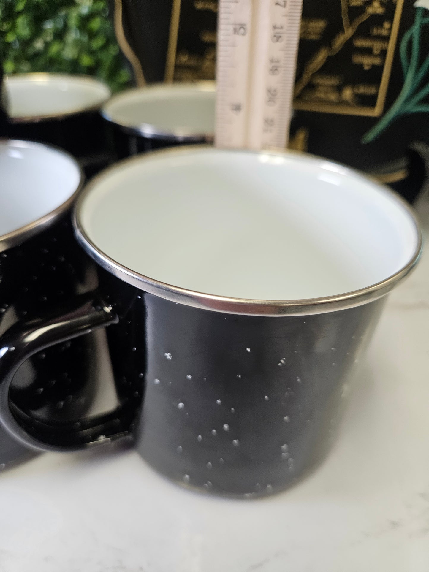 Set of 7 black enamel speckle camping mugs