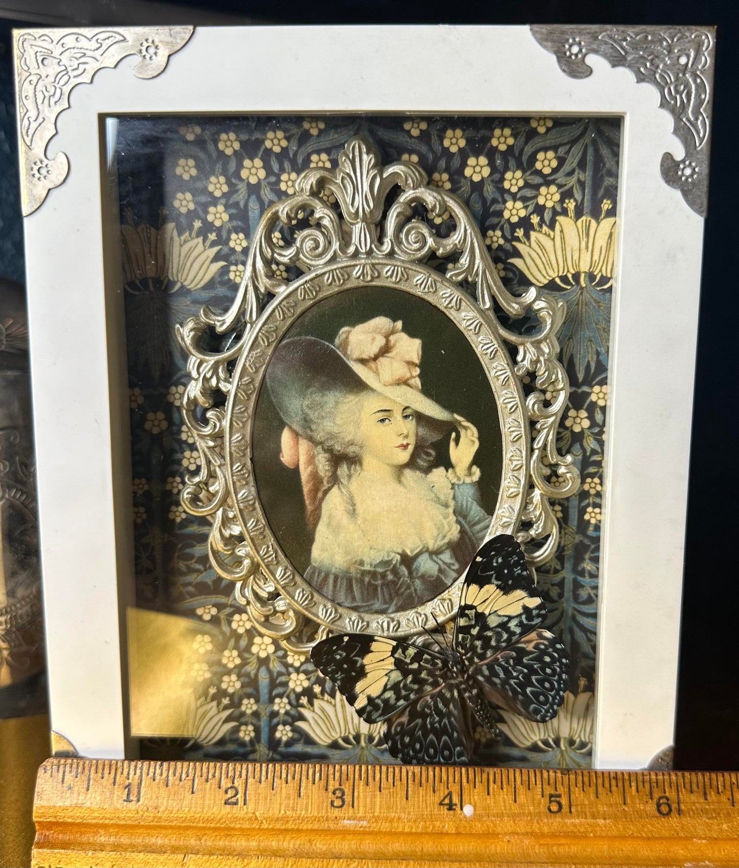 White framed ornate victorian lady blue butterfly