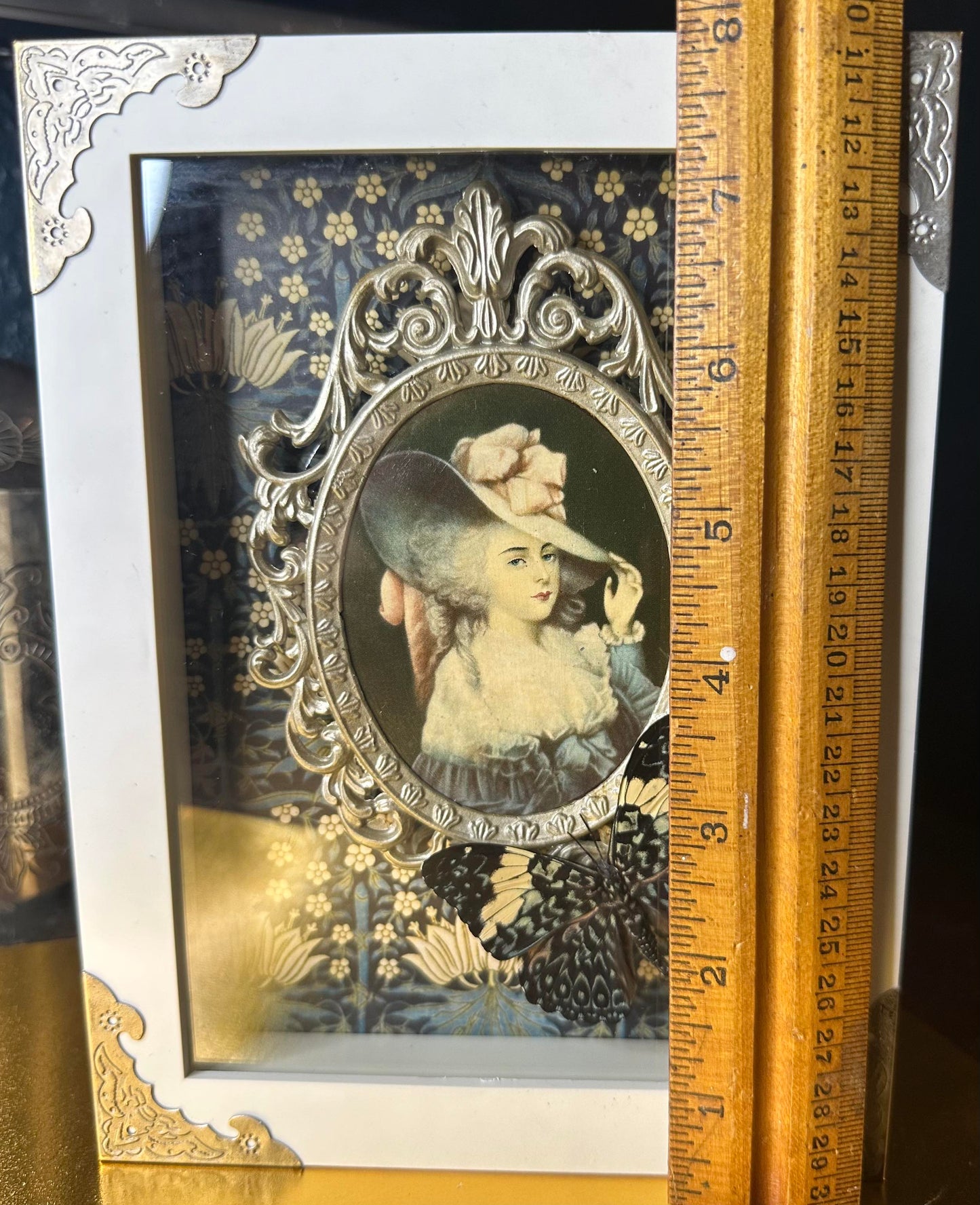 White framed ornate victorian lady blue butterfly